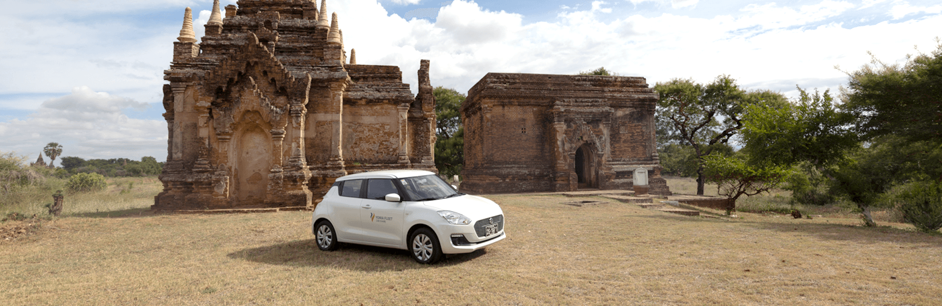 Self Drive Tips Business man hand on apple watch and steering wheel of a car that is blinded by bright sunlight in the windshield